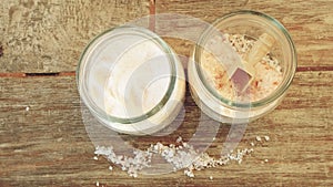 Pink himalayan salt coarse and fine salt types comparison difference in glass containers high angle view