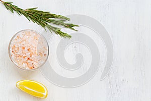 Pink Himalayan salt on the glass bowl, Bay leaf, piece of lemon, fresh garlic and mix of peppers