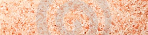 Pink himalayan salt on white background, top view