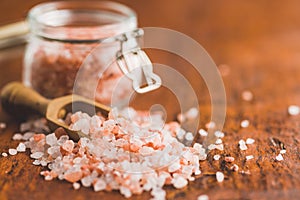 Pink himalayan salt on wooden table