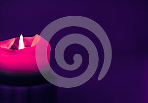 Pink holiday candle on purple background, luxury branding design and decoration for Christmas, New Years Eve and Valentines Day