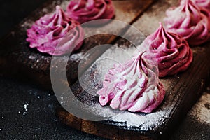 Pink homemade zephyr or marshmallow on dark background