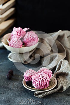 Pink homemade zephyr or marshmallow on dark background