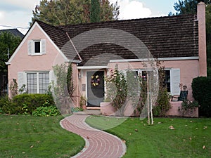 Pink house and brick trail