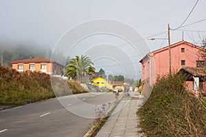Pink houses along the road in Gallegos, Asturias photo