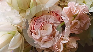 Pink hydrangea and Bush roses, large white roses in a beautiful delicate bouquet of the bride. The camera moves slowly