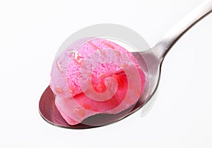 Pink ice cream on spoon