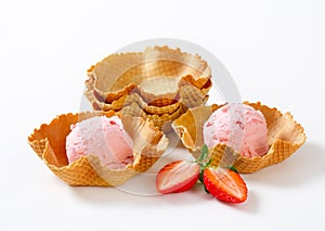 Pink ice cream in waffle baskets