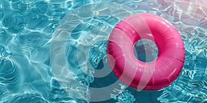 Pink inflatable ring in shimmering pool - tranquil summer day concept,