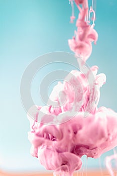 Pink ink in water, artistic shot, abstract background