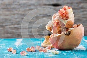 Pink juice pomegranate on wood background