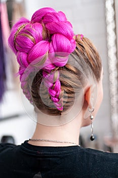 Pink kanekalon braids on a woman view from the back