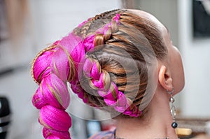 Pink kanekalon braids on a woman view from the back