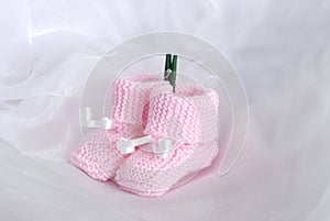 Pink knitted baby booties