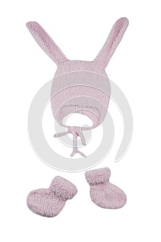 Pink knitted hat with rabbit ears and booties