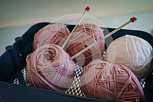 Pink knitting wool and knitting needles