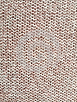 Pink knitting wool pattern background and texture