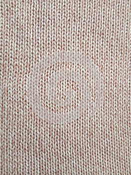 Pink knitting wool pattern background and texture