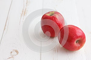 Pink lady apples on a painted wood