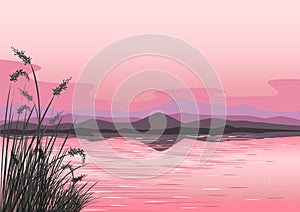 Beautiful pink landscape with sunset over the sea, mountains and reeds