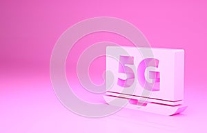 Pink Laptop with 5G new wireless internet wifi icon isolated on pink background. Global network high speed connection