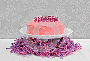 Pink Layer cake with Sweet Sixteen spelled out