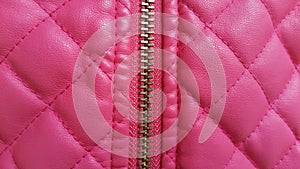 Pink leather closeup texture background. Genuine leather skin te