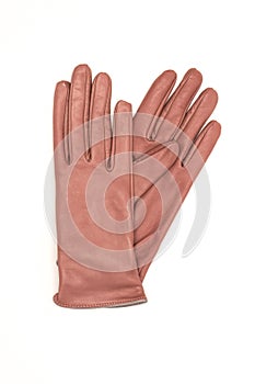 Pink leather women`s gloves on a white background