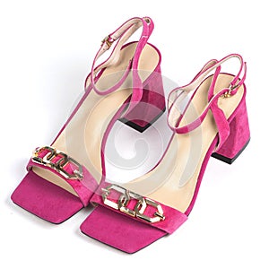 Pink leather women's sandals with a gold chain and a beige weap with a thick heel with a blunt toe on a white