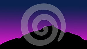 Pink light behind the mountain at night