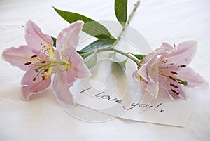 Pink lillies and a love you note