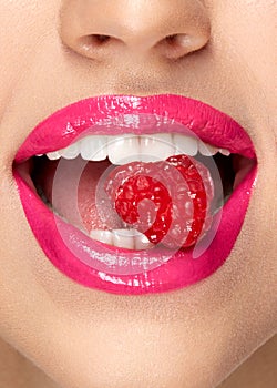 Pink Lips. Woman With Candy In Mouth.