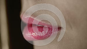 Pink lips of young woman. Pink lipstick on fashion model lips. Sensual woman mouth
