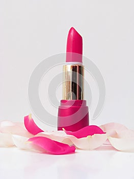 Pink lipstick and rose's petals