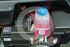 Pink Liquid Antifreeze in Coolant Tank