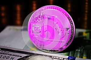 Pink Litecoin LTC coin is surrounded by a money background