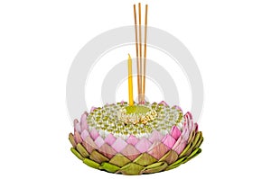 Pink lotus petal krathong that have 3 incense sticks and candle decorates with lotus pollen and crown flower