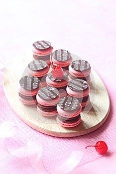 Pink Macarons Filled with Chocolate Ganache and Cherry Confit