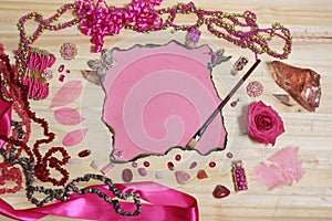 Pink and Magenta Jewelry With Flower and Blank Paper With Burned Edges