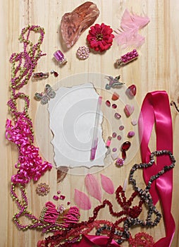 Pink and Magenta Jewelry With Rose and Blank Paper With Burned Edges