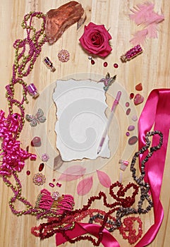 Pink and Magenta Jewelry With Rose and Blank Paper With Burned Edges