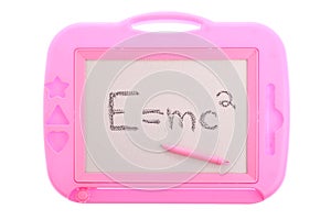 Pink magnetic drawing board with E=mc2 isolated photo