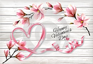 Pink magnolia flowers and ribbon shape heart on a wooden sign. Valentine`s Day background