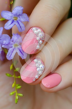 Pink manicure with mini pearls