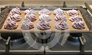 Pink marshmallows on a tray, making sweets at home