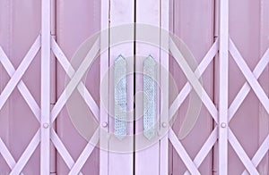 Pink metal grille sliding door with handle