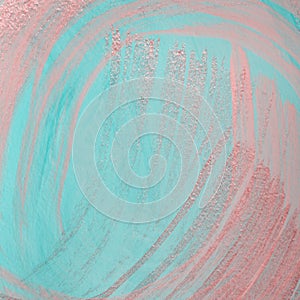 Pink metallic brush strokes on blue pastel background. Dry brush technique. Hand painted background or texture for your design