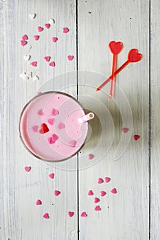 Pink milkshake sprinkled with hearts