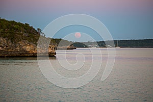 Pink Moonrise over Out Islands Settlement photo