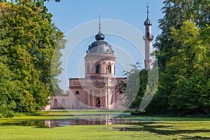 Pink mosque at the Schwetzingen palace in Germany during sunny summer day
